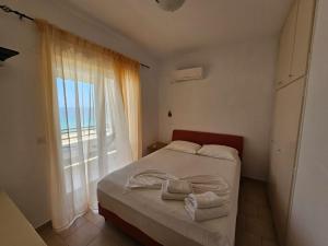 Postel nebo postele na pokoji v ubytování Corfu Dream Holidays Villas + 33 fotografií