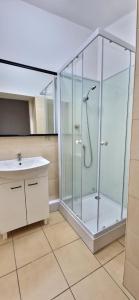 a bathroom with a shower and a sink at Prywatny pokój dla dwóch osób Pokój 2 in Warsaw