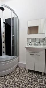 a bathroom with a tub and a sink and a shower at Prywatny pokój dla dwóch osób Pokój 2 in Warsaw