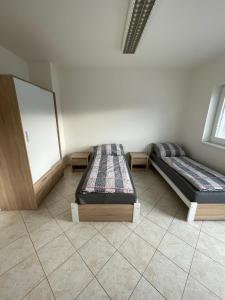 Postel nebo postele na pokoji v ubytování Ubytování Pardubice Trnová