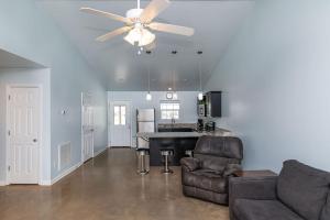a living room with a ceiling fan and a couch at Camp Margaritaville Breaux Bridge in Breaux Bridge +29 photos
