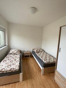 Postel nebo postele na pokoji v ubytování Ubytování Pardubice Trnová