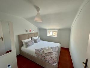 Postel nebo postele na pokoji v ubytování Lugar dos Avós