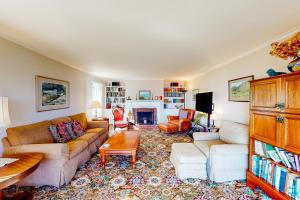 a living room with a couch and a table at Pigeon Hill Retreat in Steuben