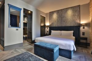 Postel nebo postele na pokoji v ubytování FORVM bijoux ROOMS