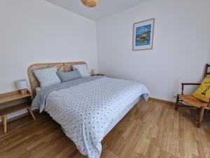 Postel nebo postele na pokoji v ubytování Gîte de Kerninon Maison spacieuse et lumineuse