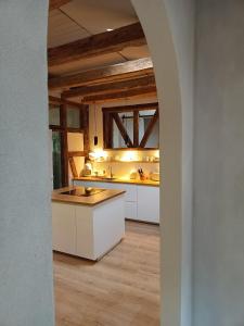 a kitchen with white cabinets and a counter top at Annel's Träumerei in Radebeul