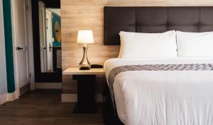 Postel nebo postele na pokoji v ubytování Colony Hotel