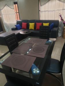 a living room with a couch and a table at Fafape in Lomé