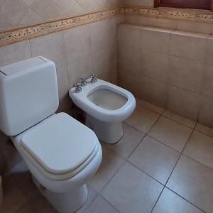 a bathroom with a white toilet and a bidet at Altos H in Santiago del Estero