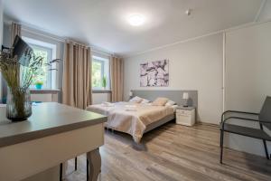 Łóżko lub łóżka w pokoju w obiekcie Willa Sonata - Apartamenty & Balia - Szklarska Poręba