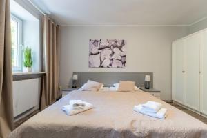 Łóżko lub łóżka w pokoju w obiekcie Willa Sonata - Apartamenty & Balia - Szklarska Poręba