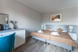 Łóżko lub łóżka w pokoju w obiekcie Willa Sonata - Apartamenty & Balia - Szklarska Poręba
