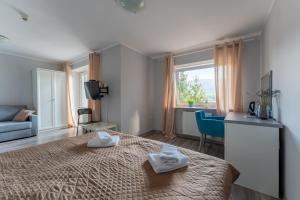 Łóżko lub łóżka w pokoju w obiekcie Willa Sonata - Apartamenty & Balia - Szklarska Poręba