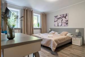 Łóżko lub łóżka w pokoju w obiekcie Willa Sonata - Apartamenty & Balia - Szklarska Poręba