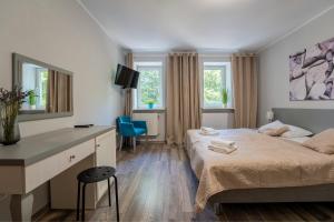 Łóżko lub łóżka w pokoju w obiekcie Willa Sonata - Apartamenty & Balia - Szklarska Poręba