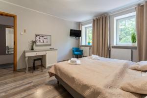 Łóżko lub łóżka w pokoju w obiekcie Willa Sonata - Apartamenty & Balia - Szklarska Poręba