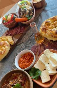 a table topped with lots of different types of food at Country House Mitrovic in Babušnica