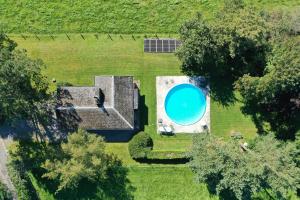 an overhead view of a house with a swimming pool at Sy - Les Aywisses in Ferrières