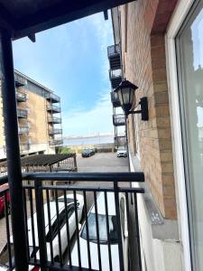 a balcony with a view of a parking lot at 2 Bed Luxury Apt in Gravesend in Kent