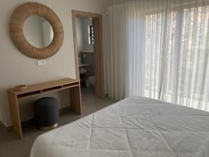 Letto o letti in una camera di SANTOSHA