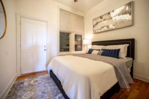a bedroom with a large bed and a window at Getaway in the Heart of Pilsen Chicago in Chicago