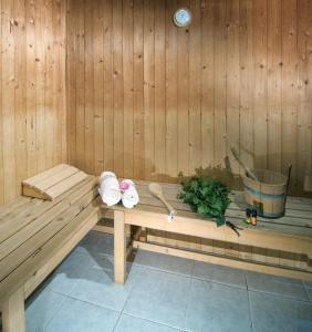 a sauna with a bench with towels on it at Pension Luky in Špindlerův Mlýn