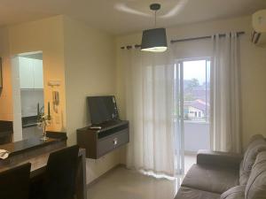 Televisyen dan/atau pusat hiburan di RCM Vilas - Loft mobiliado no Glória