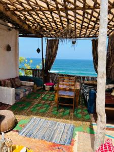 a living room with a view of the ocean at TAMRI BEACH HOUSE in Tamri