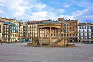 a building with a gazebo in the middle of a city at APARTAMENTO CALLE CURIA 6 in Pamplona