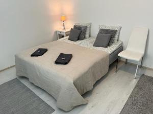 Postel nebo postele na pokoji v ubytování StyleStudio Areena2