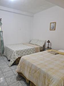 Postel nebo postele na pokoji v ubytování Estrada residence