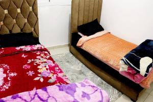 Ein Bett oder Betten in einem Zimmer der Unterkunft Appartement à M'diq