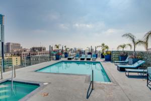 a swimming pool on the roof of a building at Downtown Los Angeles Condo with Shared Rooftop Pool! in Los Angeles