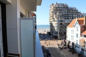 a view of a city from a window in a building at Chez Pascal - Nieuport in Nieuwpoort