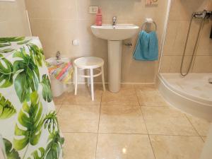 a bathroom with a sink and a bath tub and a sink at Anaga Tucho Natural Beach House in Santa Cruz de Tenerife +58 photos