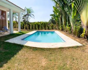 una piscina en el patio de una casa en Villa Sueño Caribeño N 91 en Boca Chica