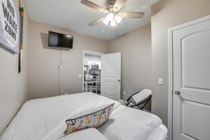 a bedroom with a bed and a ceiling fan at Pet-Friendly Murray Vacation Rental with Grill! in Murray