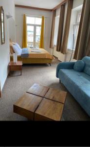 Postel nebo postele na pokoji v ubytování Hotel Radnice