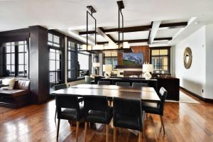 a dining room and living room with a table and chairs at Flagstaff #301 in Park City