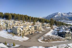 an aerial view of a resort in the snow at Deer Run Condo - 12 Blacktail Buck in Big Sky