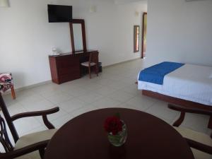 Postel nebo postele na pokoji v ubytování Hotel Boutique Casa Bella
