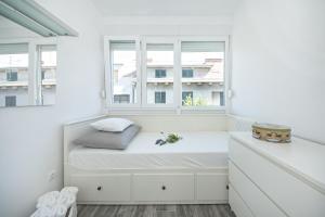 Postel nebo postele na pokoji v ubytování City Smart Apartment