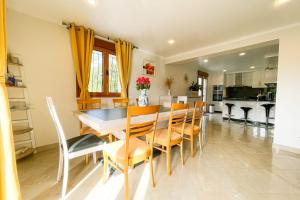 a kitchen and dining room with a table and chairs at The House of Sunny Gardens - #FW in Saint-Ismier