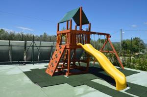 a small playground with a slide and a slideintend at Il Borgo Dell'Ulivo in Trevi