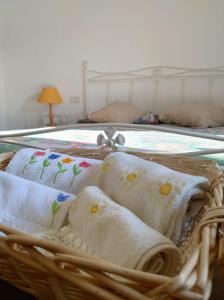 מיטה או מיטות בחדר ב-Ranch la Valle arcidosso