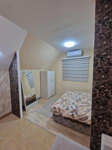 Postel nebo postele na pokoji v ubytování Apartman Kruna