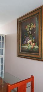 a picture of a painting of fruit on a wall at hermosa habitacion en casa residencial in Guadalajara