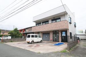 a white van parked in a parking lot in front of a building at cold - Vacation STAY 69755v in Kumamoto