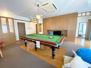 a living room with a pool table in it at cold - Vacation STAY 69755v in Kumamoto